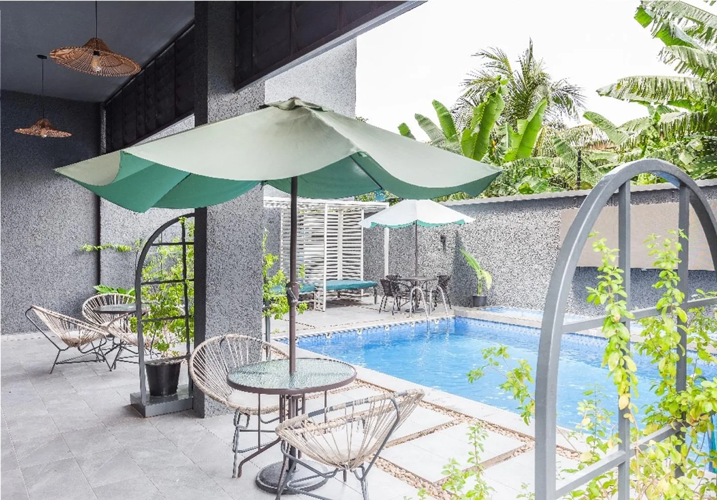 Covered terrace seating overlooking the pool