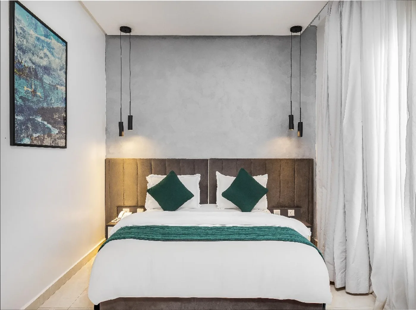 Classic Room with white linens and emerald accents